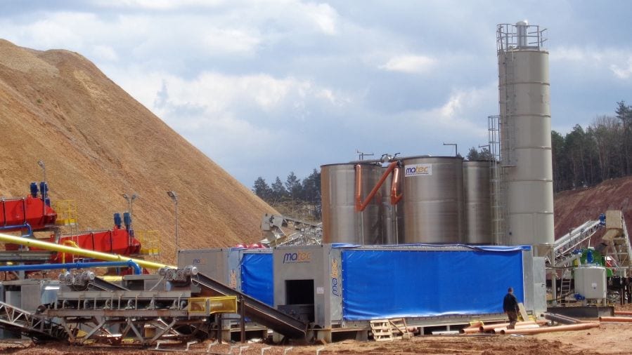 cube filter press in use with water clarifier towers