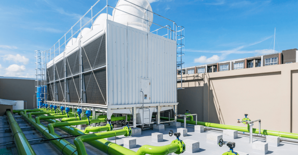 cooling tower on roof with green pipes