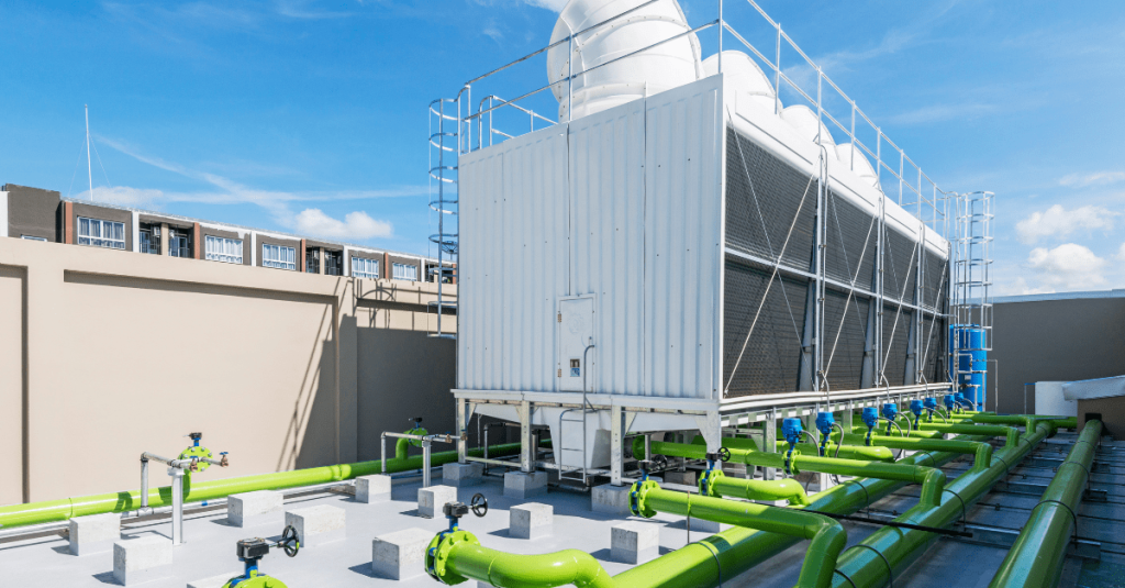cooling tower on roof with green pipes